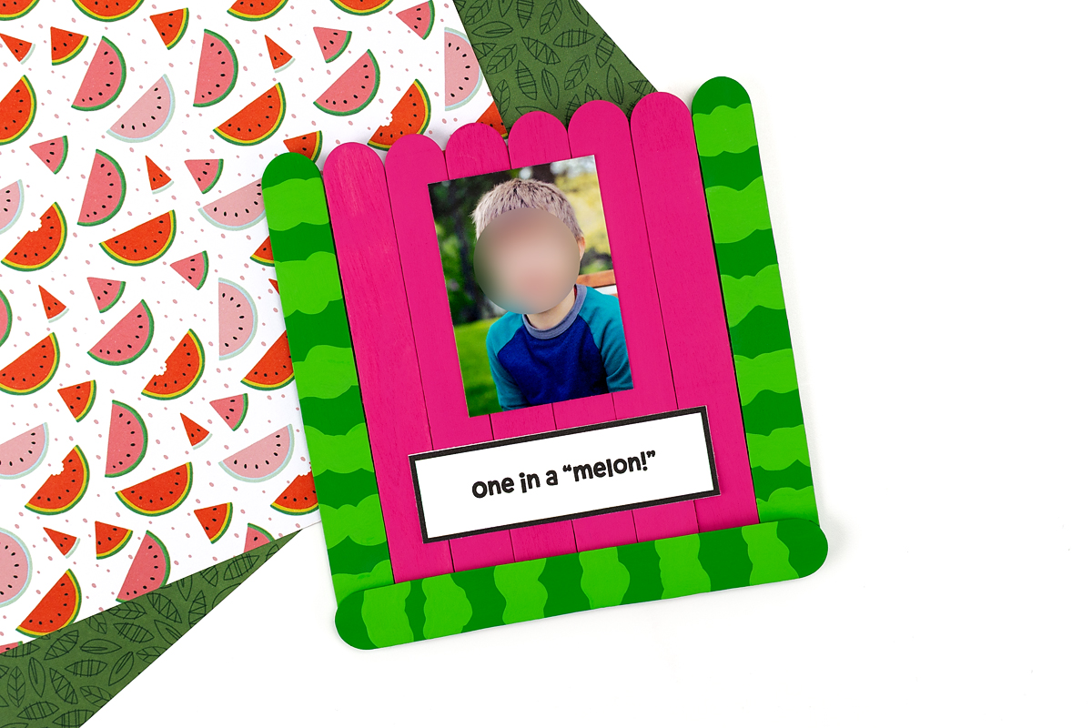 Step 5 of the watermelon craft on a colorful background.
