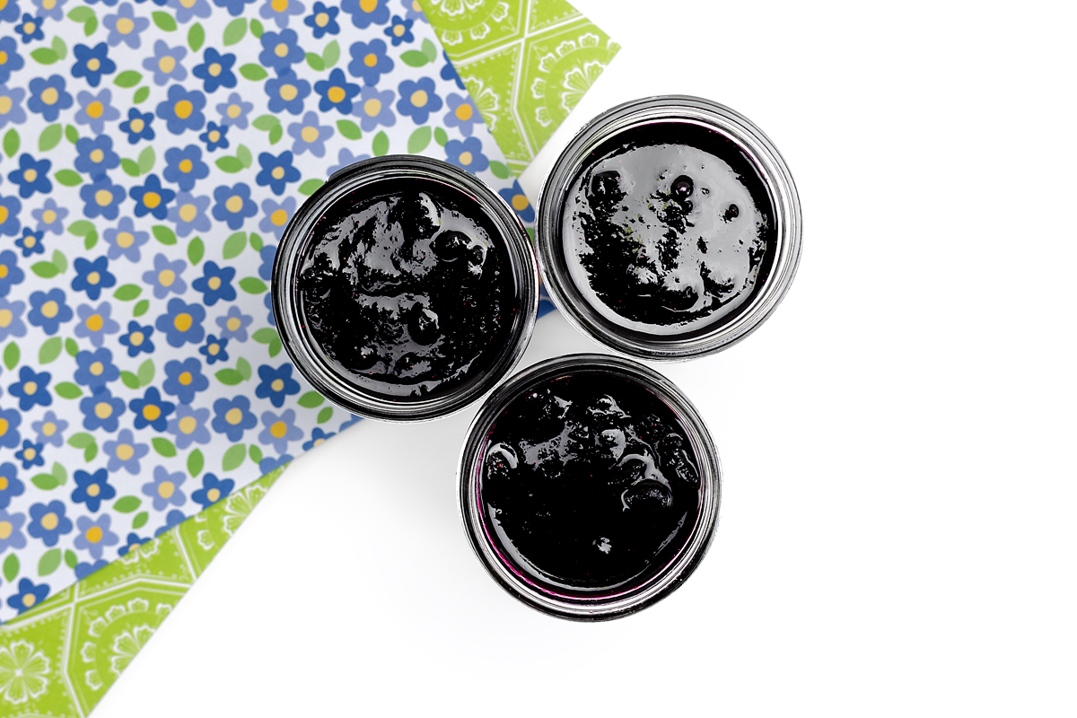 Blueberry jam in glass mason jars.