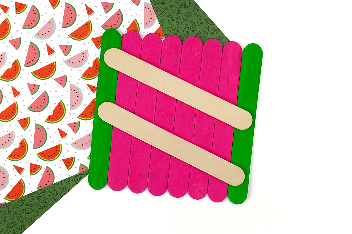 Step 3 of the popsicle stick watermelon craft for kids.