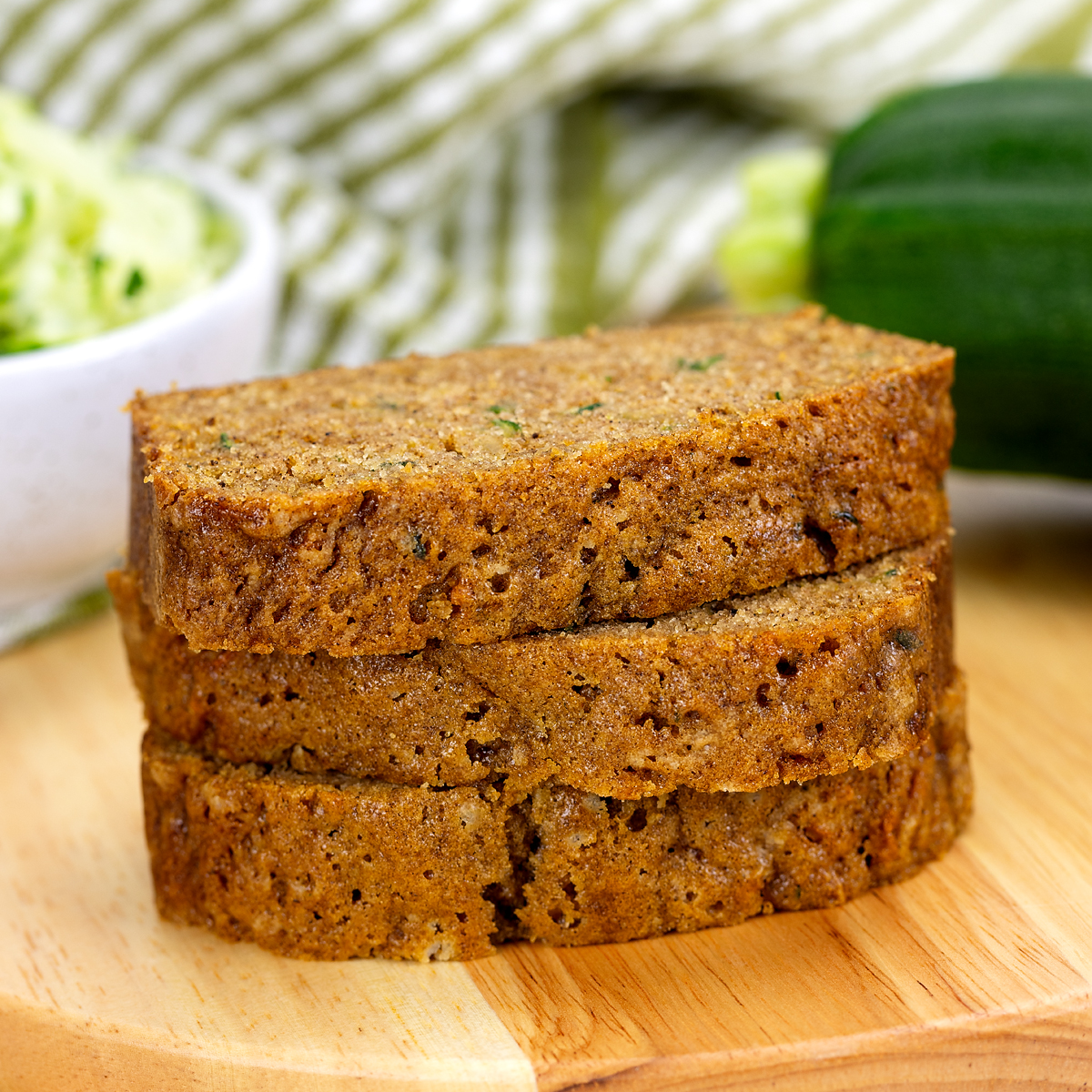3 stacked slices of zucchini bread.