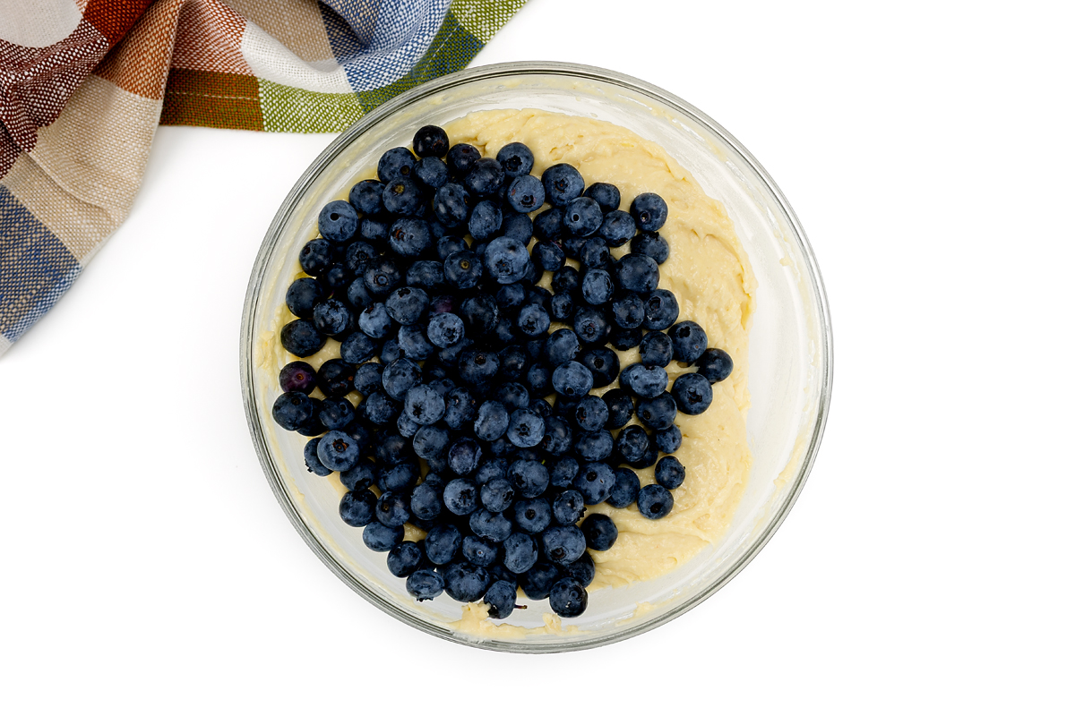 Blueberries in muffin batter.