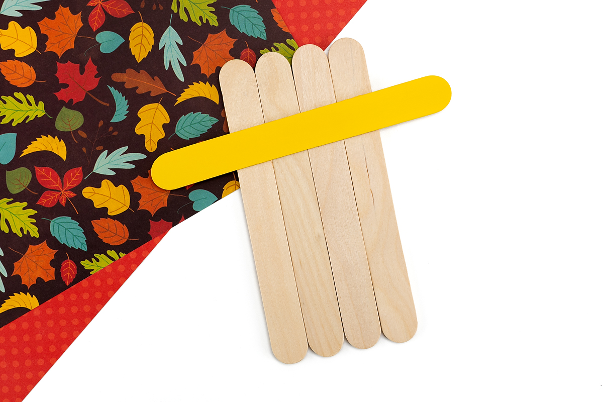 Popsicle stick base with hat brim added.