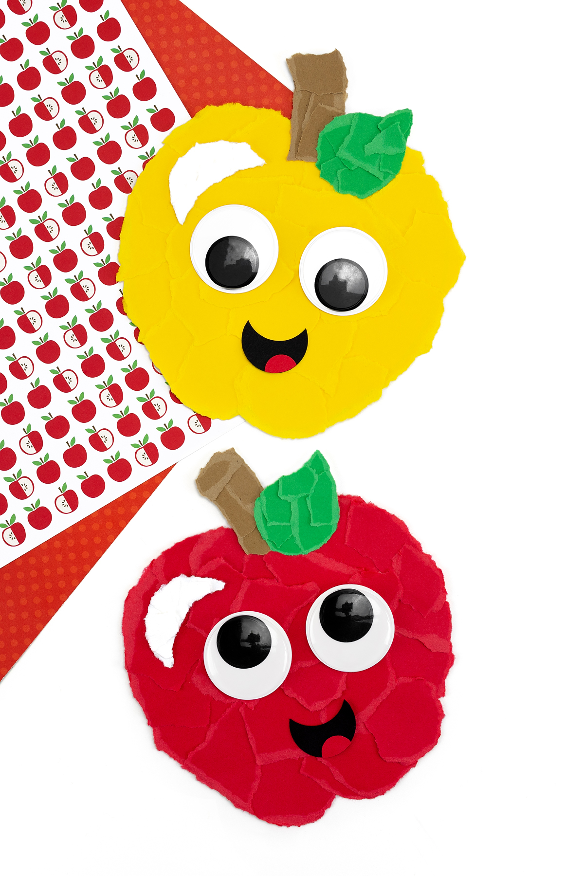Stacked yellow and red apple crafts.