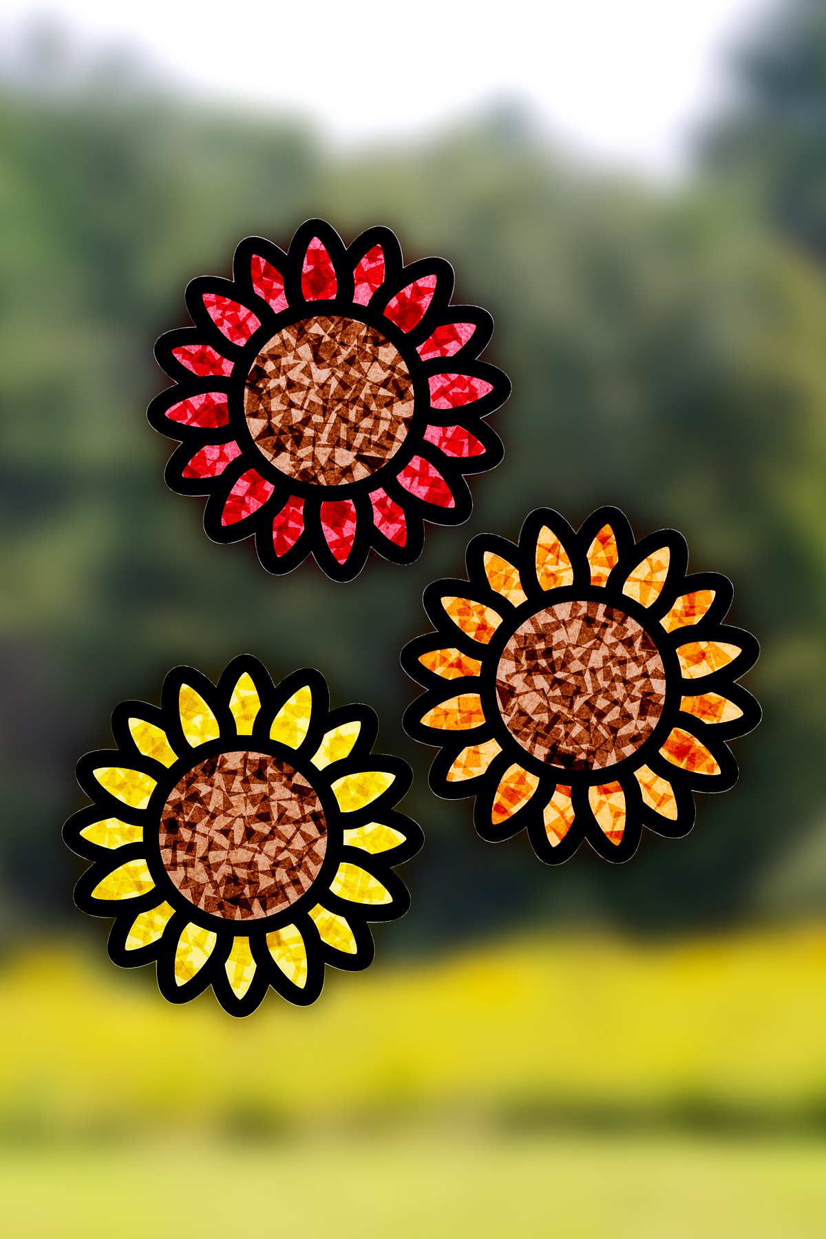 Sunflower suncatcher craft with yellow petals and a colorful center made from tissue paper for kids.
