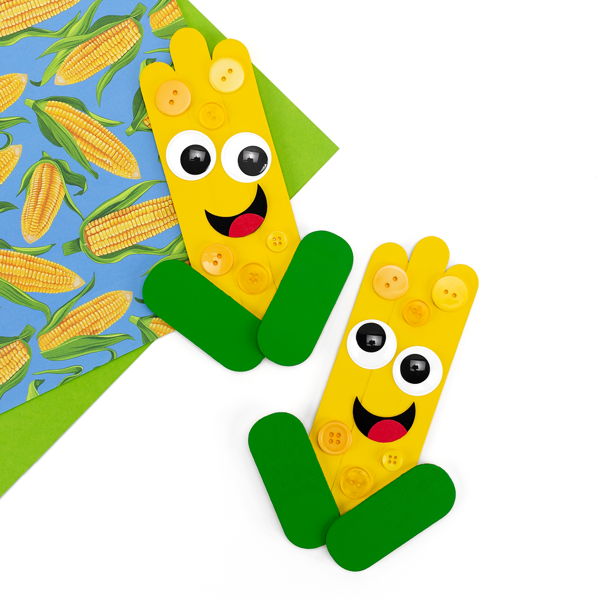 Two popsicle stick corn crafts.