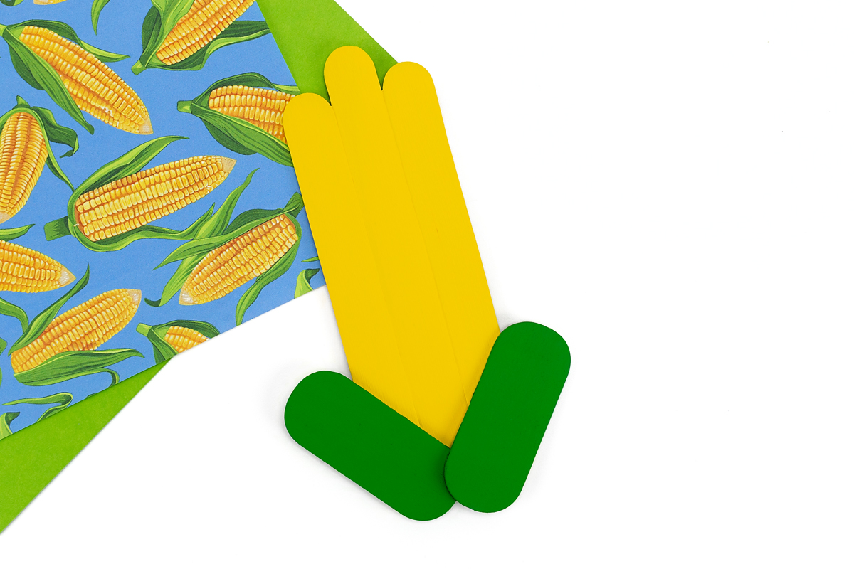 Step 3 of the popsicle stick corn craft.