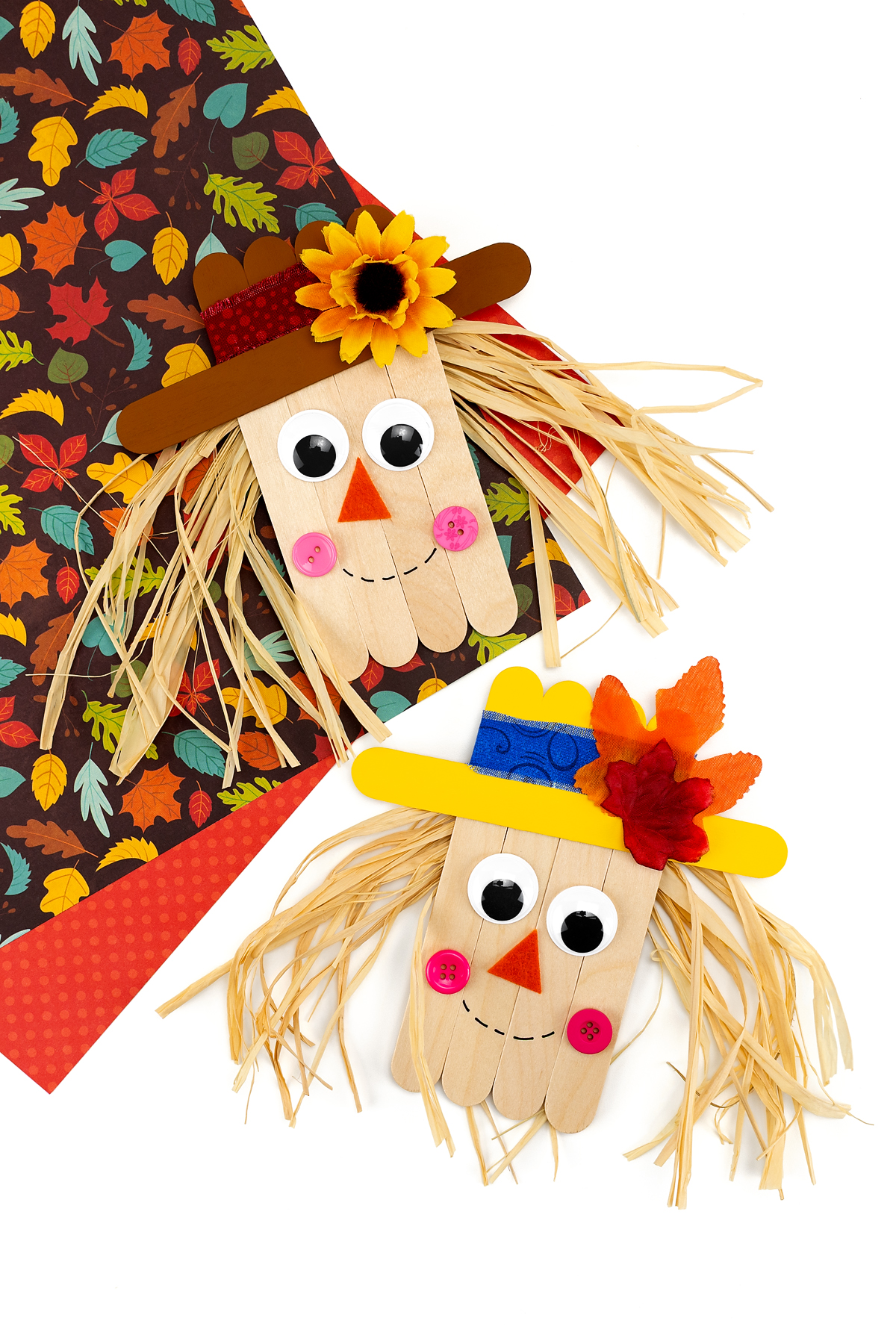 Two finished popsicle stick scarecrows.