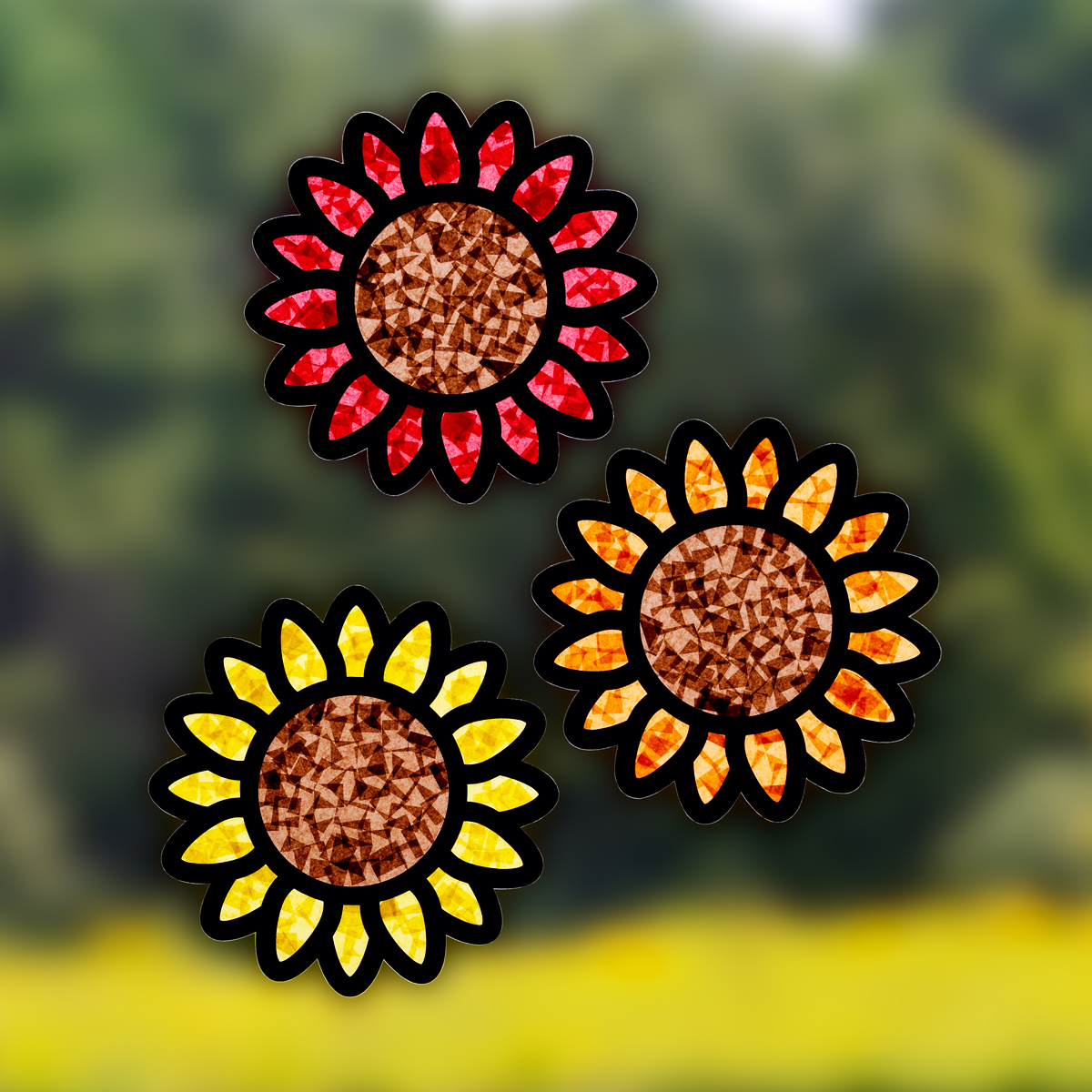 Red, orange, and yellow Sunflower Suncatchers hanging on the window.