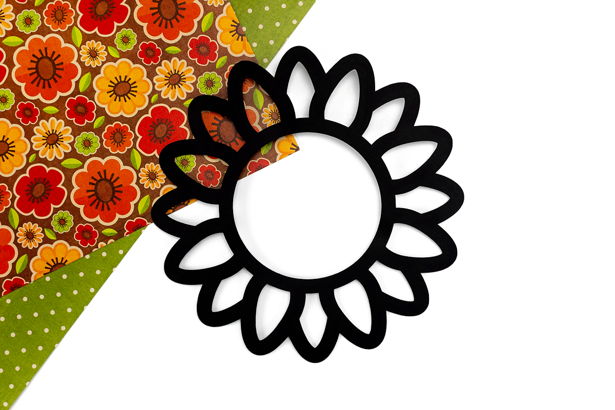 Sunflower Suncatcher cut out on black cardstock.