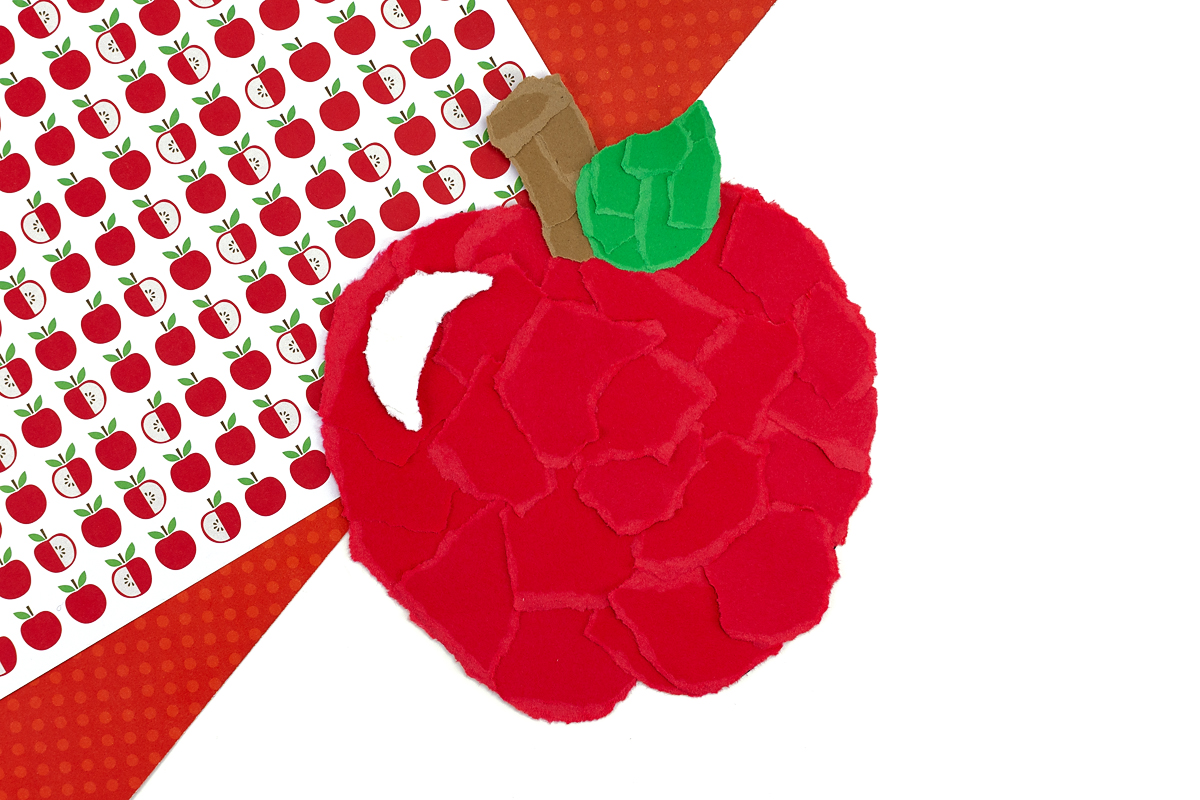 Completed torn paper apple craft.