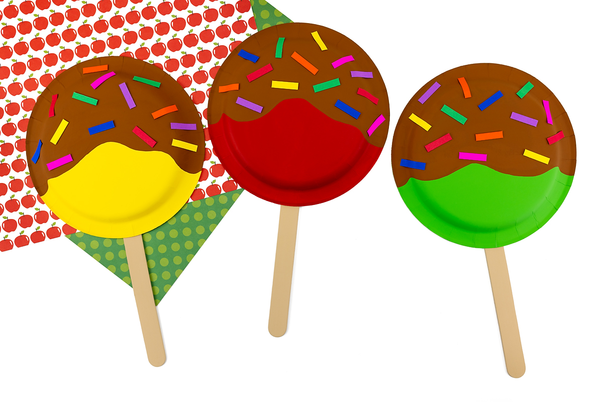 Yellow, red, and green paper plate apples.