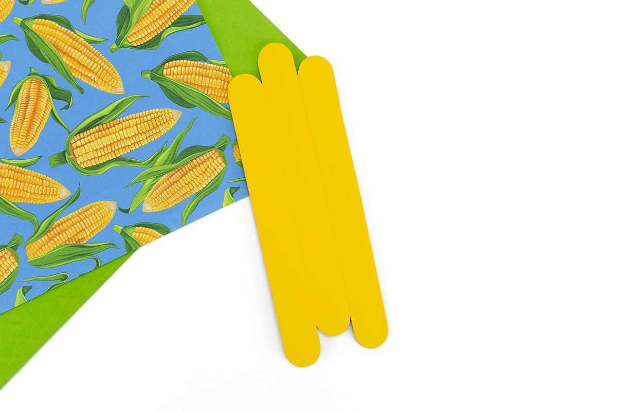 Yellow popsicle sticks formed into a corn cob.