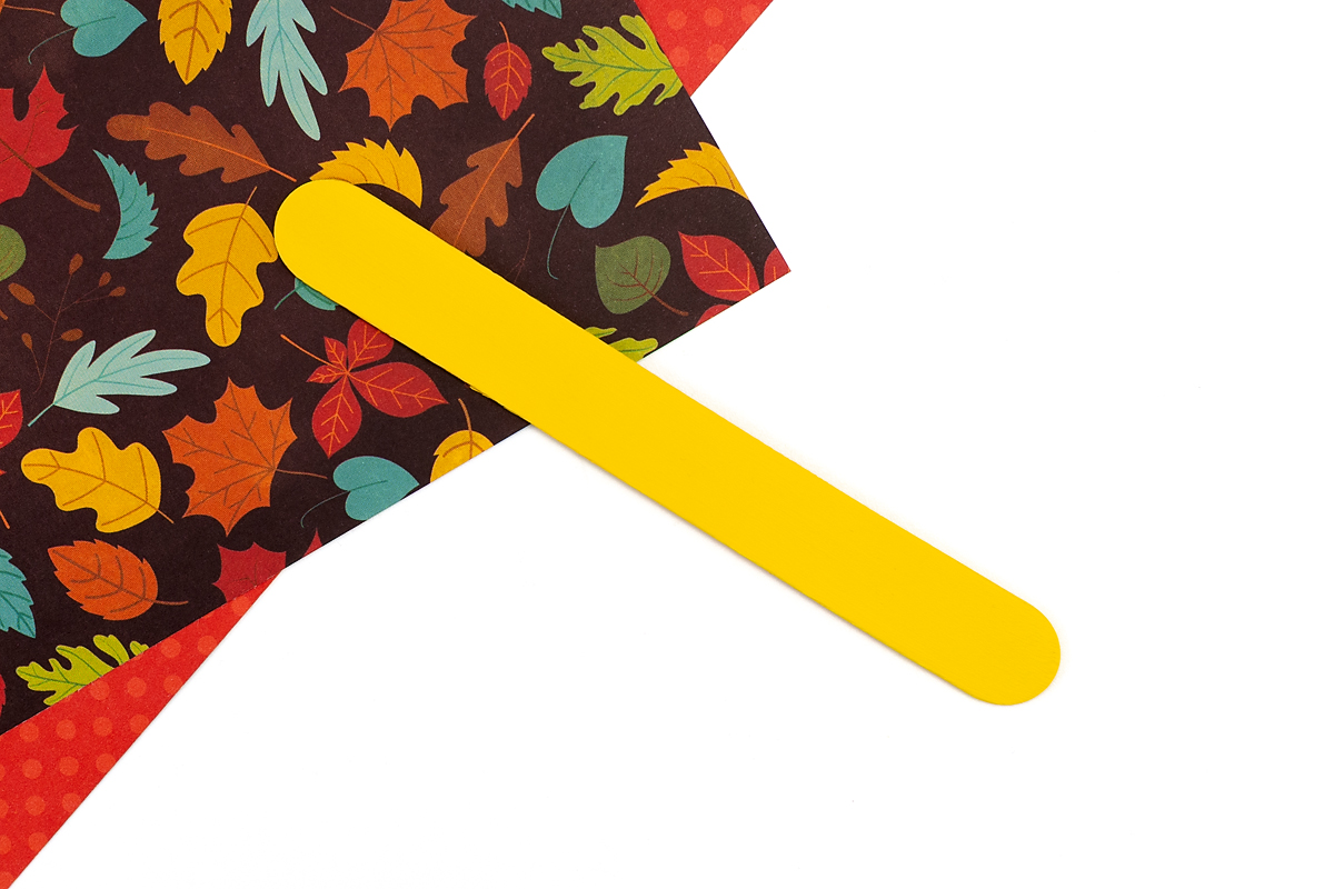 Yellow painted popsicle stick.