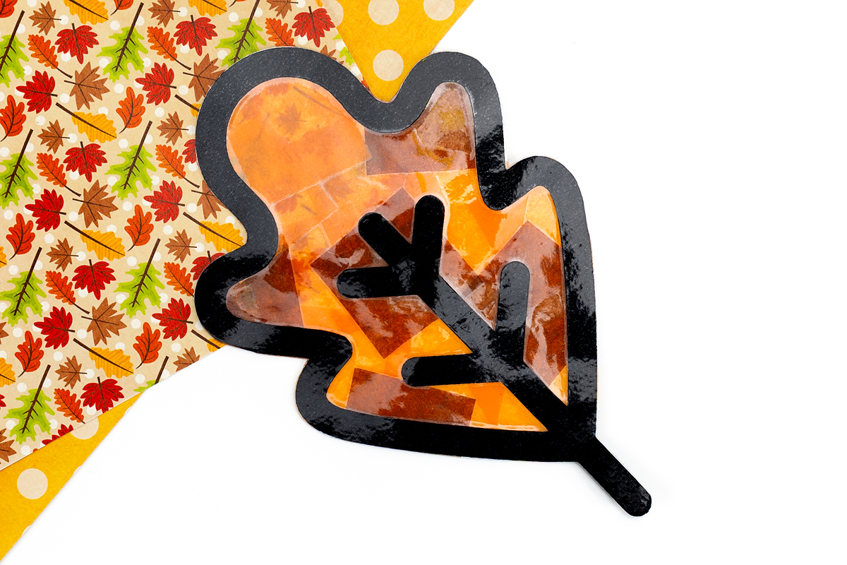 Finished leaf suncatcher craft.