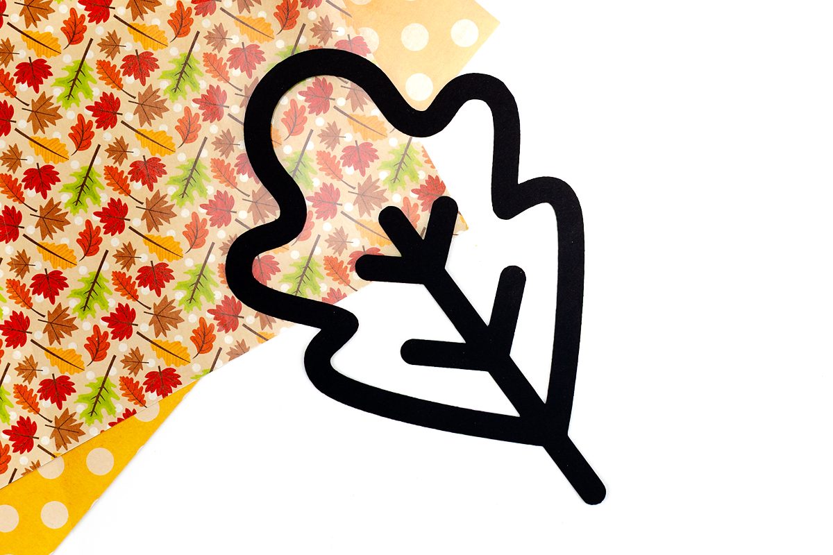Fall leaf suncatchers on contact paper.