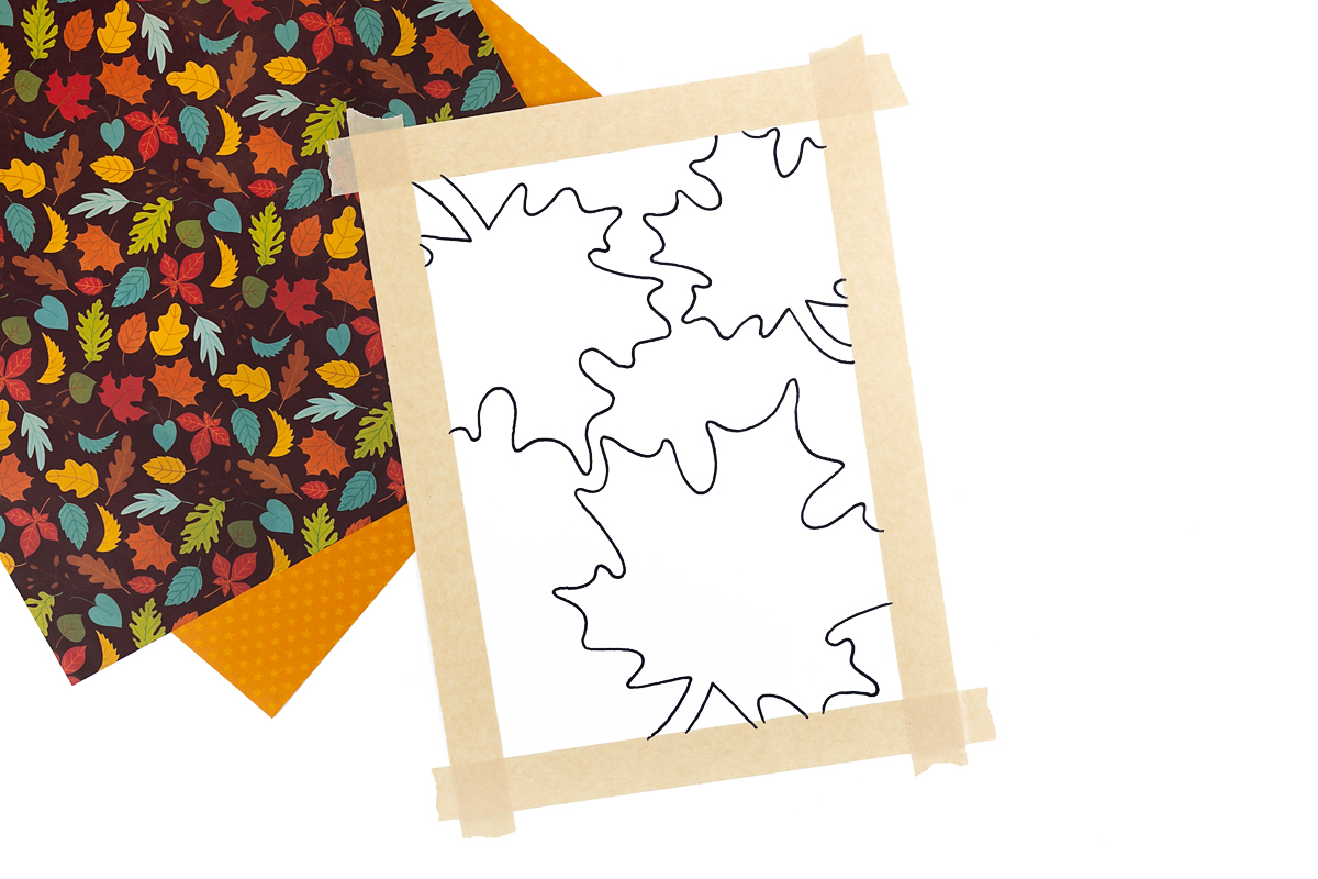 Leaves traced on white paper.