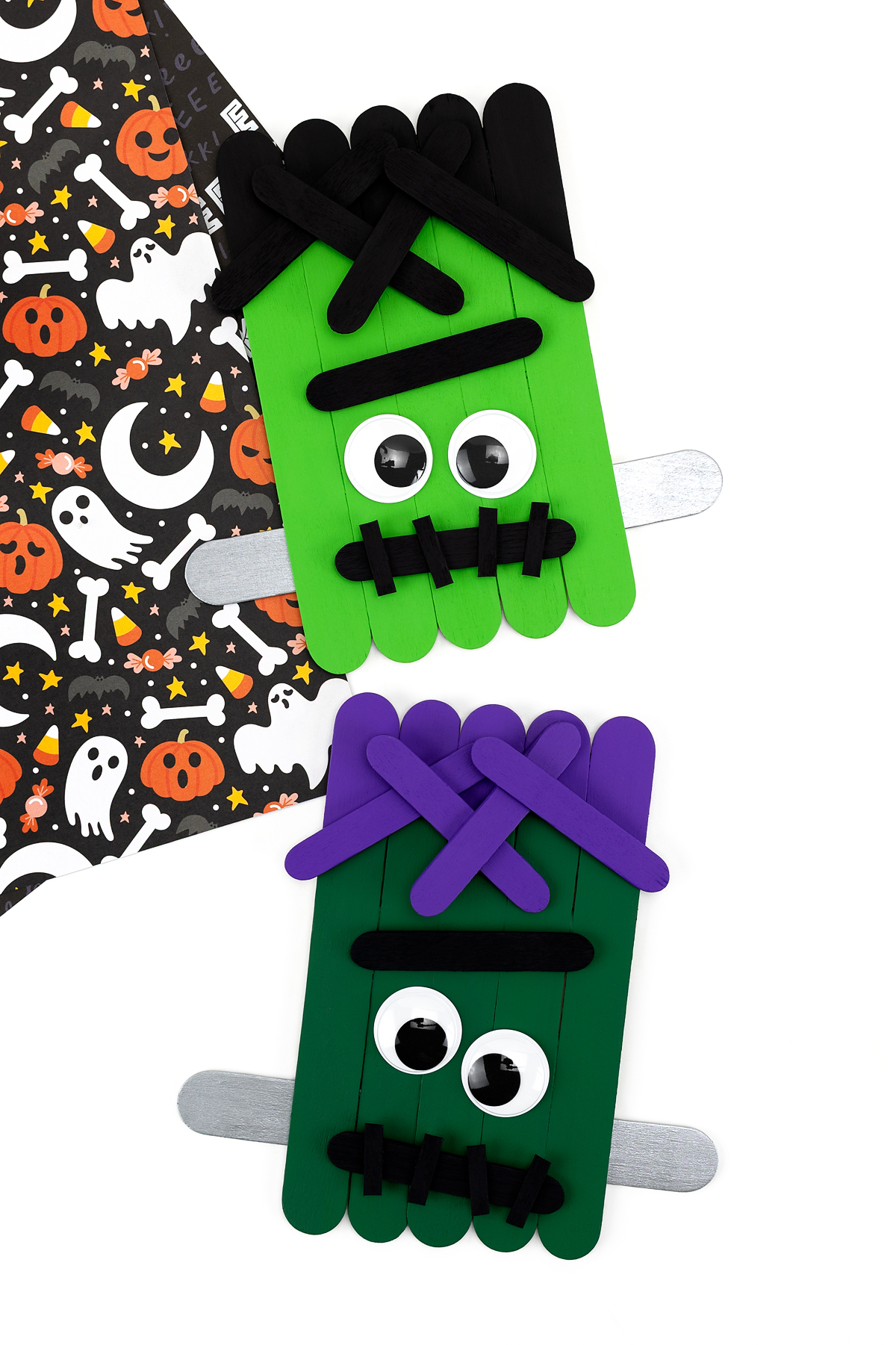 Two green Popsicle Stick Frankenstein crafts for kids.