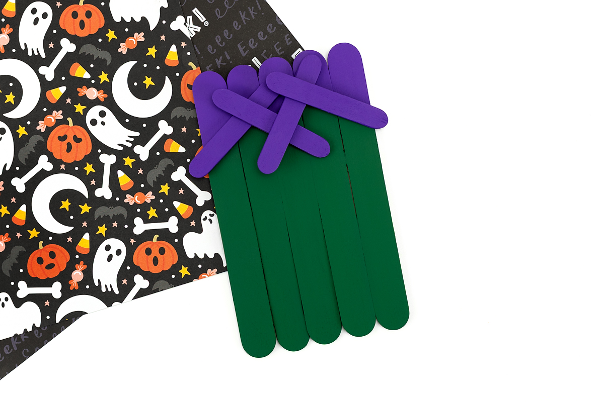 Painted popsicle sticks for the beginning steps of a Frankenstein craft.