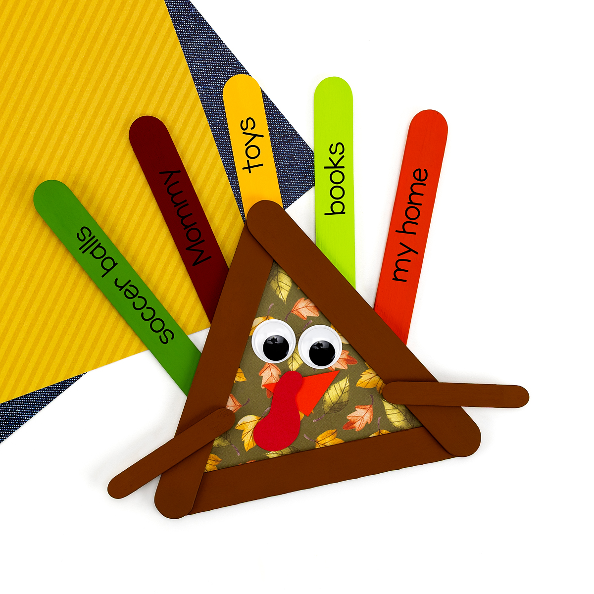 Craft stick turkey with green body.