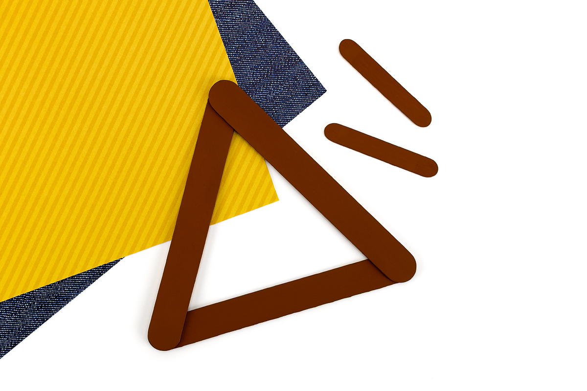 Popsicle stick turkey base painted brown.