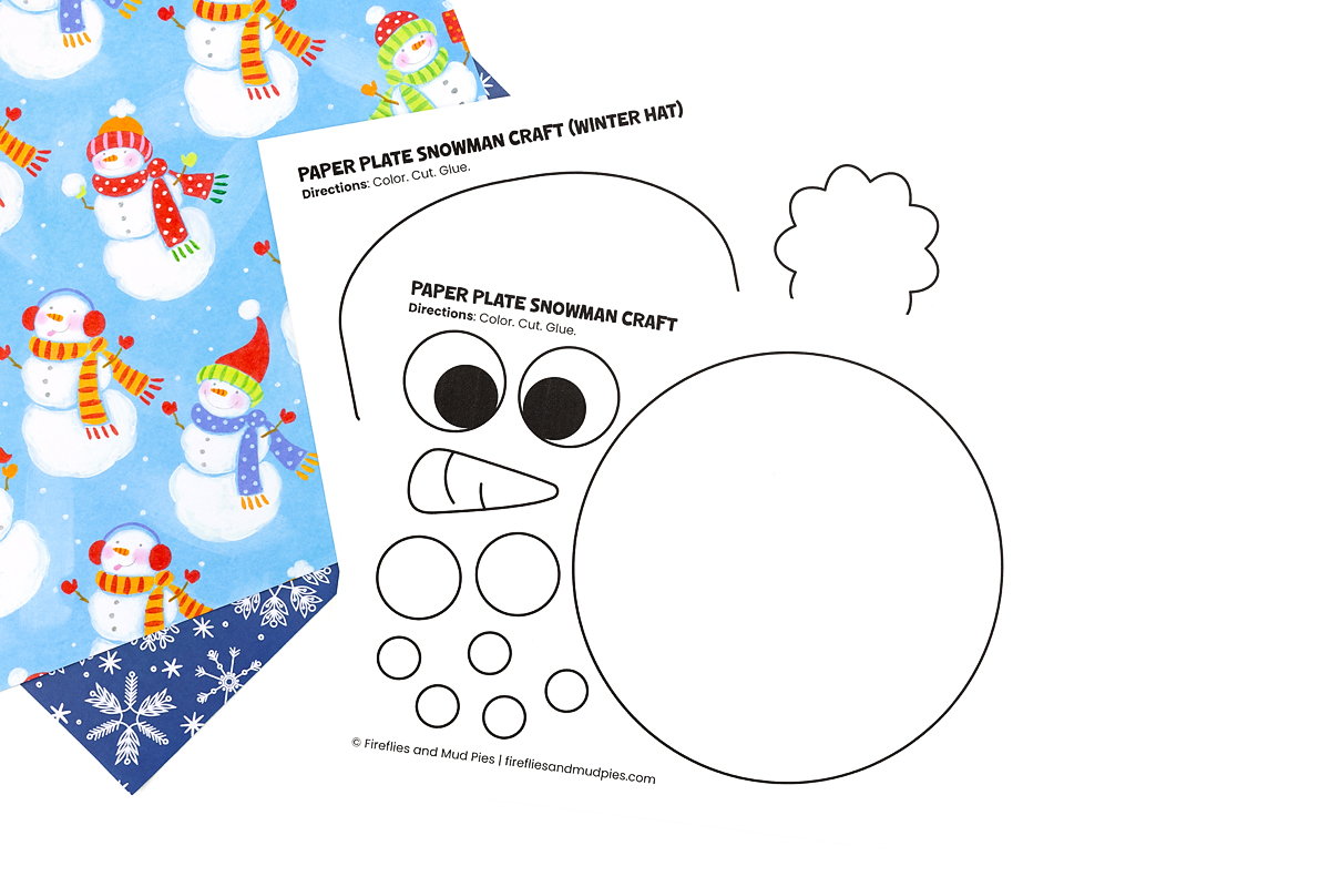Printed snowman hat and face templates on white cardstock laid flat on a table.