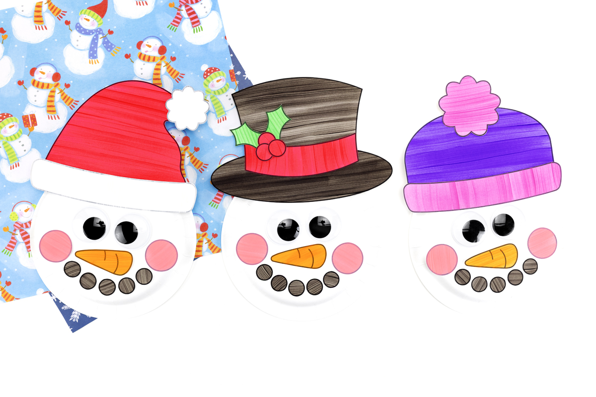 Three paper plate snowman crafts wearing a Santa hat, top hat, and winter hat, displayed against a neutral background.