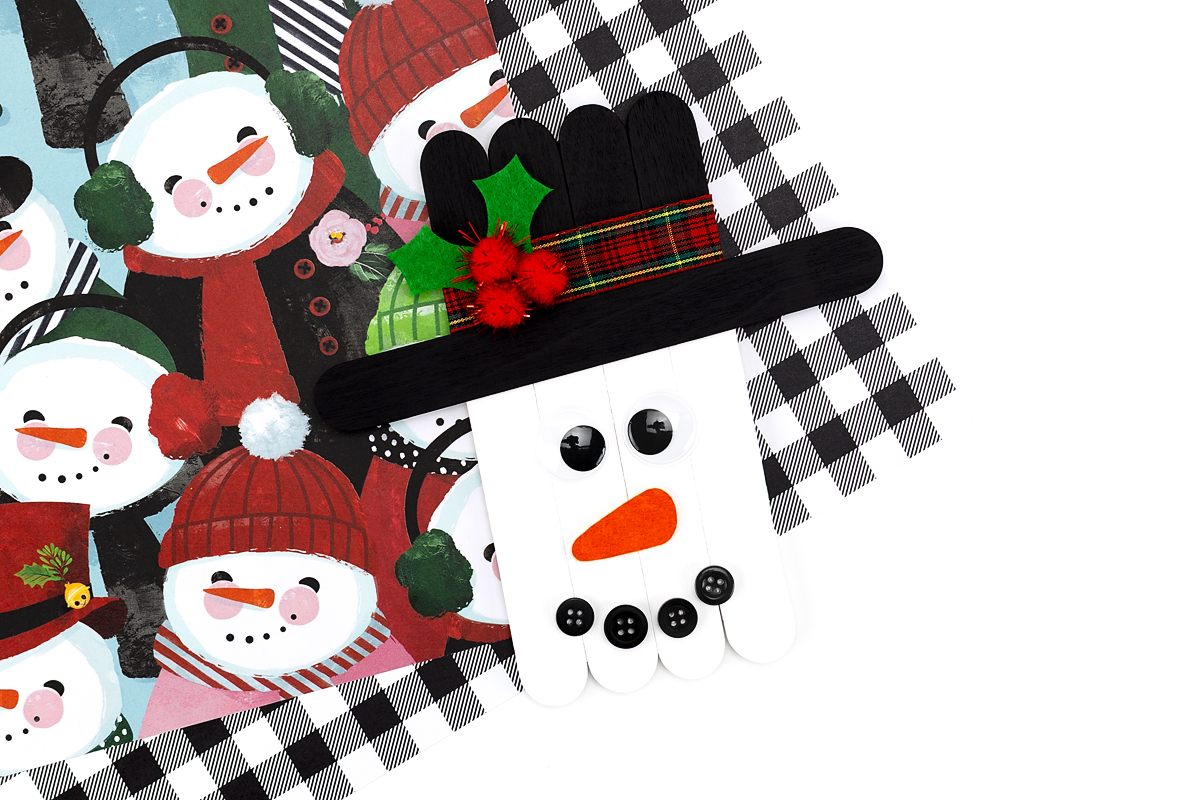 Finished Popsicle Stick Snowman craft ready for display.