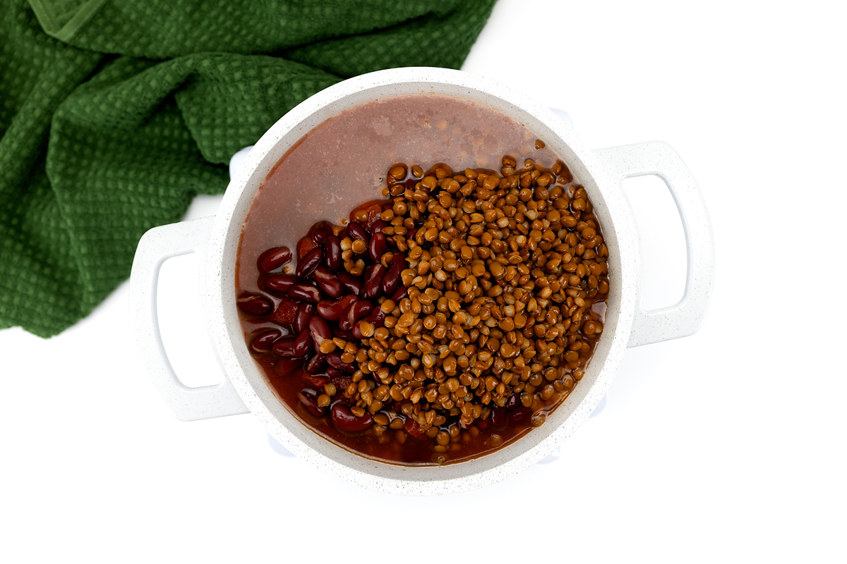 Kidney beans and lentils stirred into turkey chili near the end of cooking.