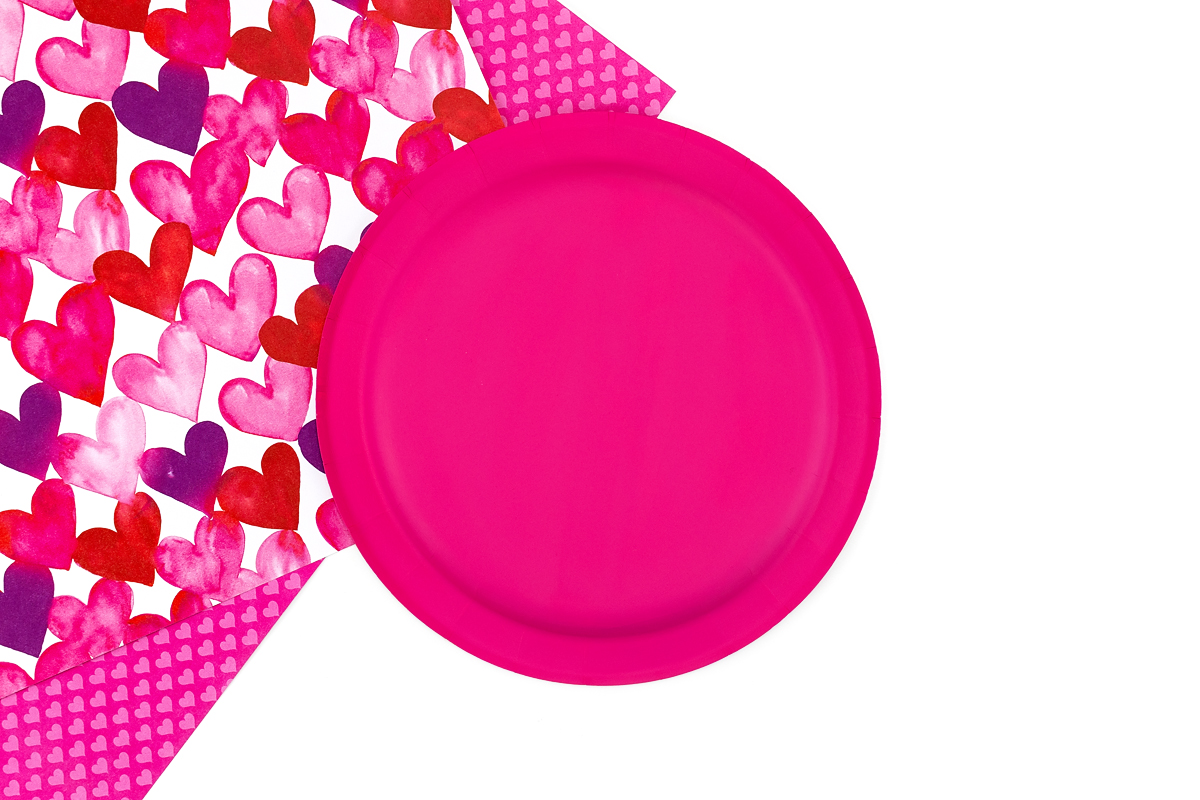 A painted paper plate ready for crafting.