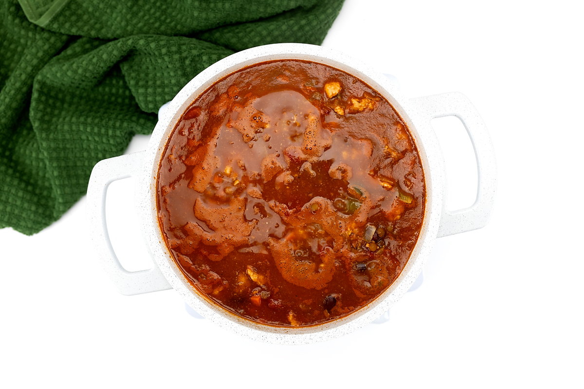 Turkey chili simmering uncovered on the stove to thicken.