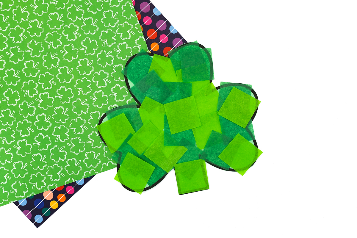 Completed preschool shamrock craft drying on a flat surface.