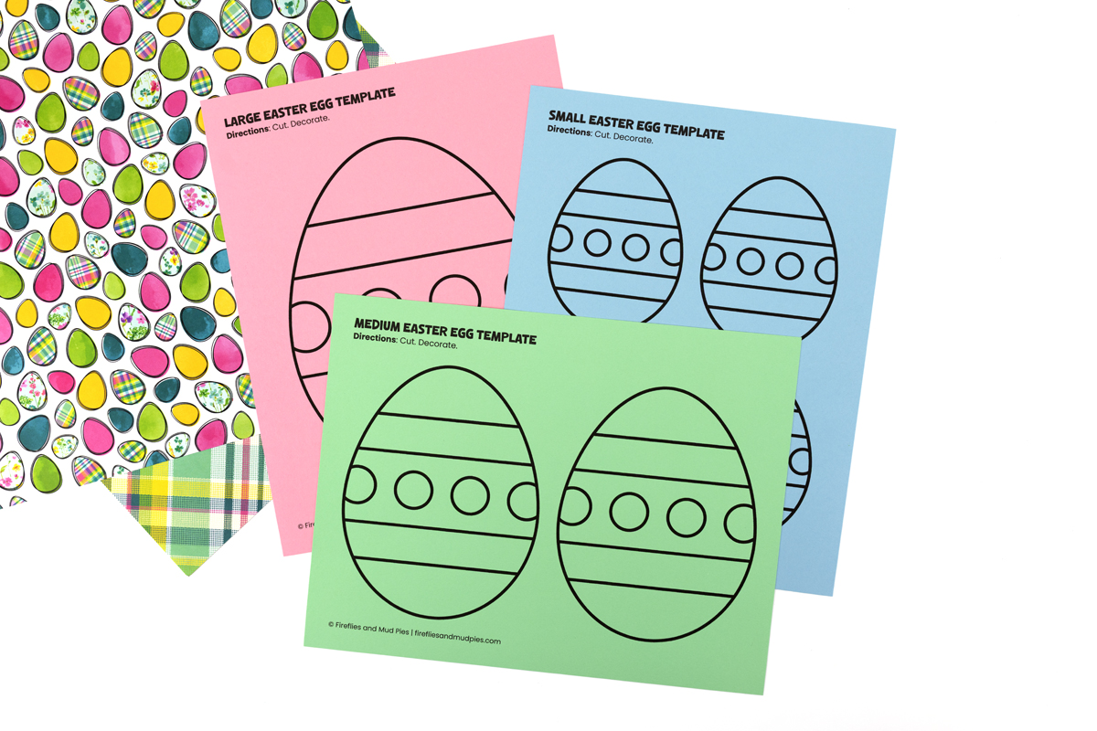 Easter egg templates in three sizes— large, medium, and small—printed on pink, green, and blue paper showing a stripes and dots pattern.