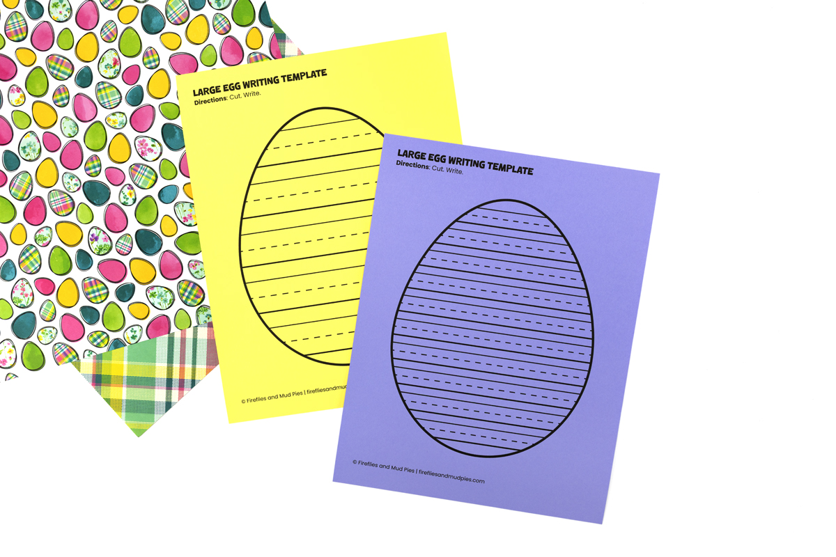 Large Easter egg writing templates with lined pages printed on yellow and purple paper, perfect for spring classroom writing activities.