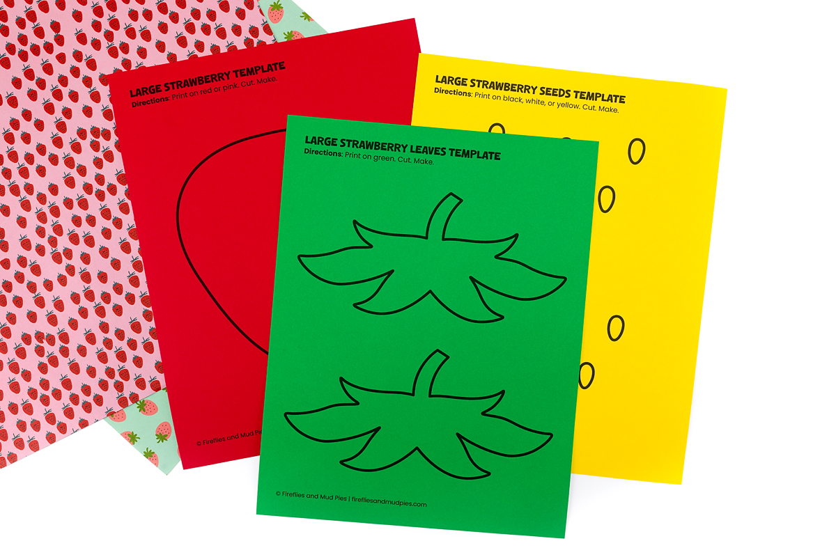 Build-your-own large strawberry template printable pages showing separate red strawberry body, green leaves, and yellow seeds templates printed on colored paper.Build your own strawberry with this free printable! The large strawberry template includes separate pages for the body, leaves, and seeds — just print each piece on the right color paper, cut, and assemble. Part of a free 18-page strawberry template set at Fireflies and Mud Pies!