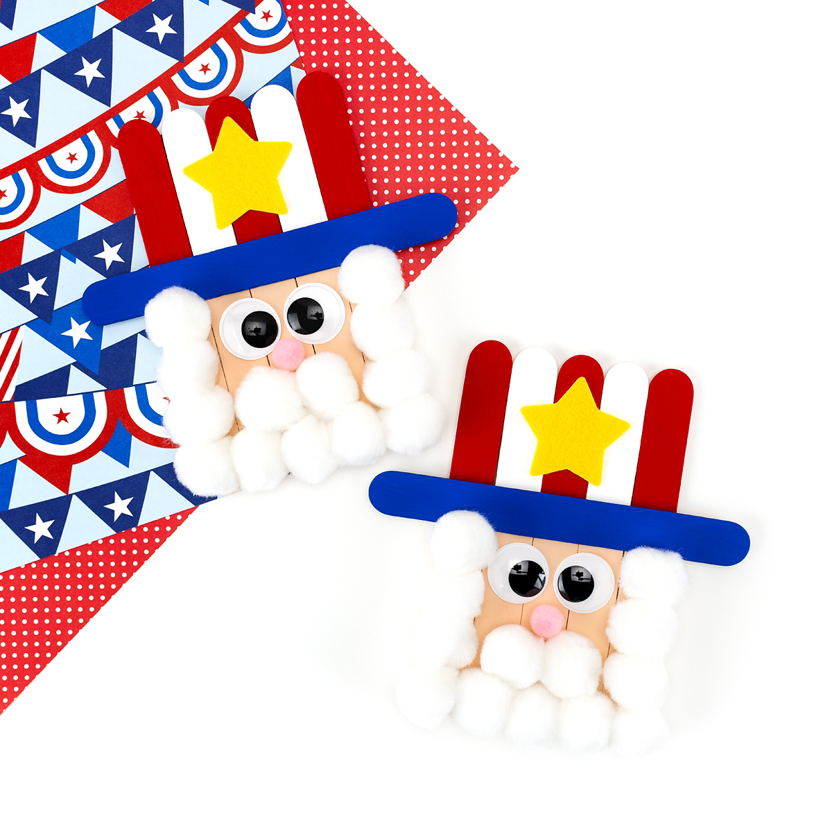 Two Uncle Sam popsicle stick crafts for kids with white pom pom beards, wiggle eyes, and red white and blue painted craft sticks.