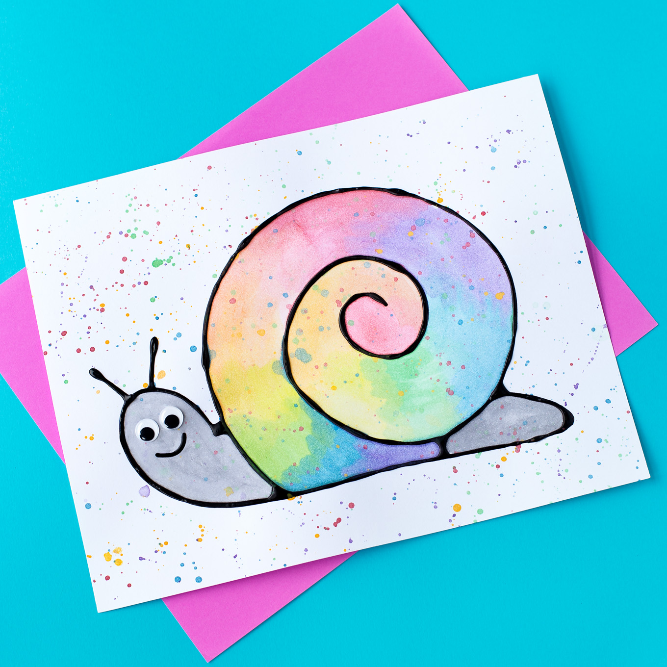 Learn how to make Black Glue and Watercolor Snail Art. This craft includes a free template, making it perfect for home or school. 