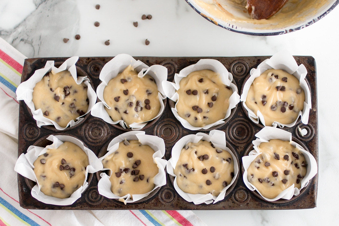 Chocolate Chip Muffin Batter in Muffin Tins
