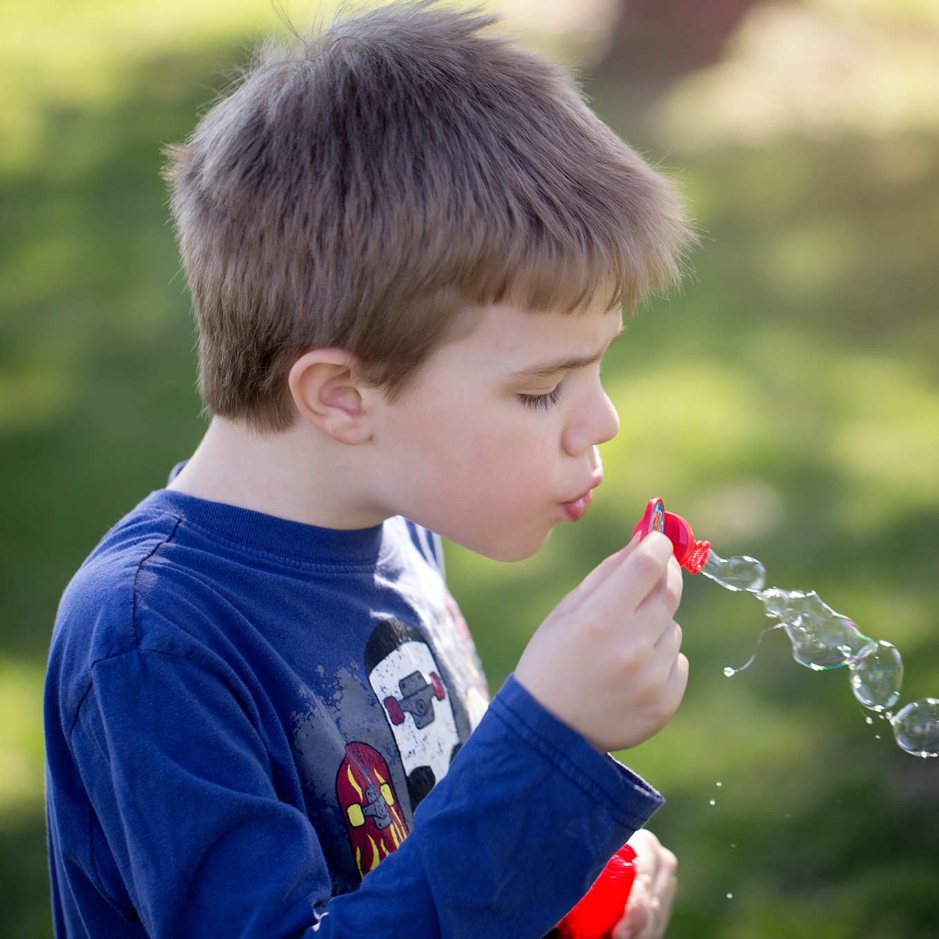 Child Blowing Bubbles Child Blowing Bubbles