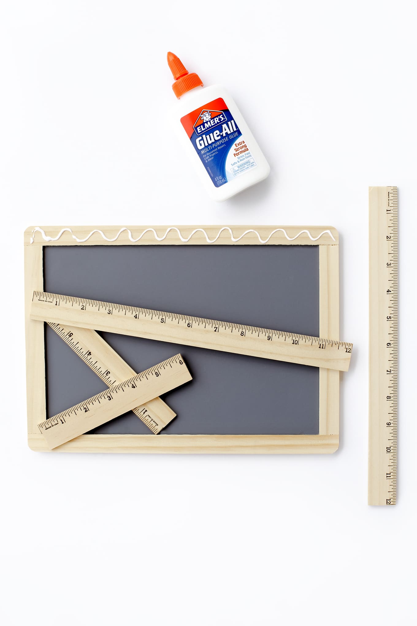 Learn how to make an easy DIY First Day of School Sign. It's the perfect back to school photo prop for kids!