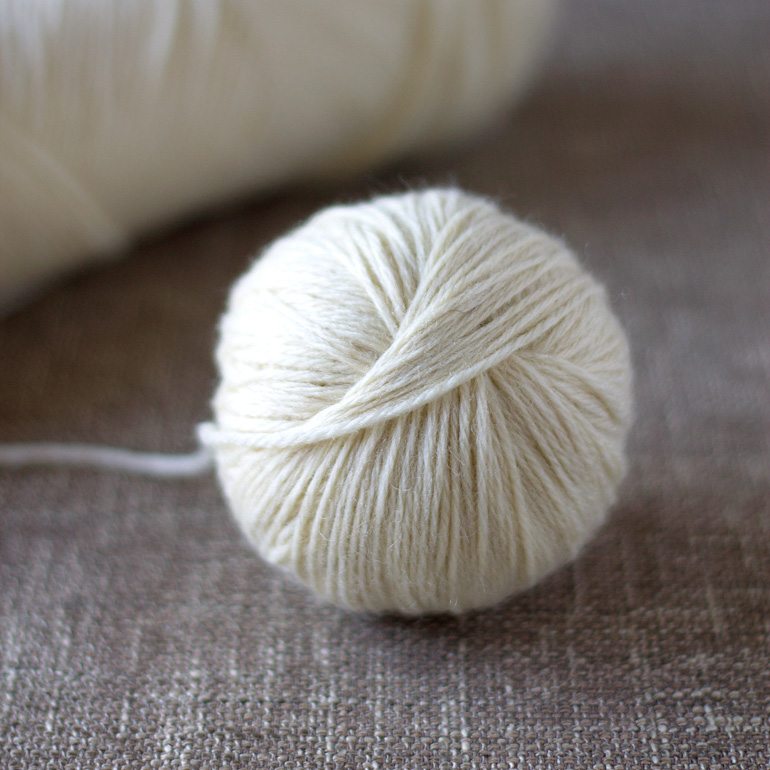 Discover money saving natural laundry tips and tricks and learn how to make wool dryer balls to soften clothes and speed drying time, naturally.