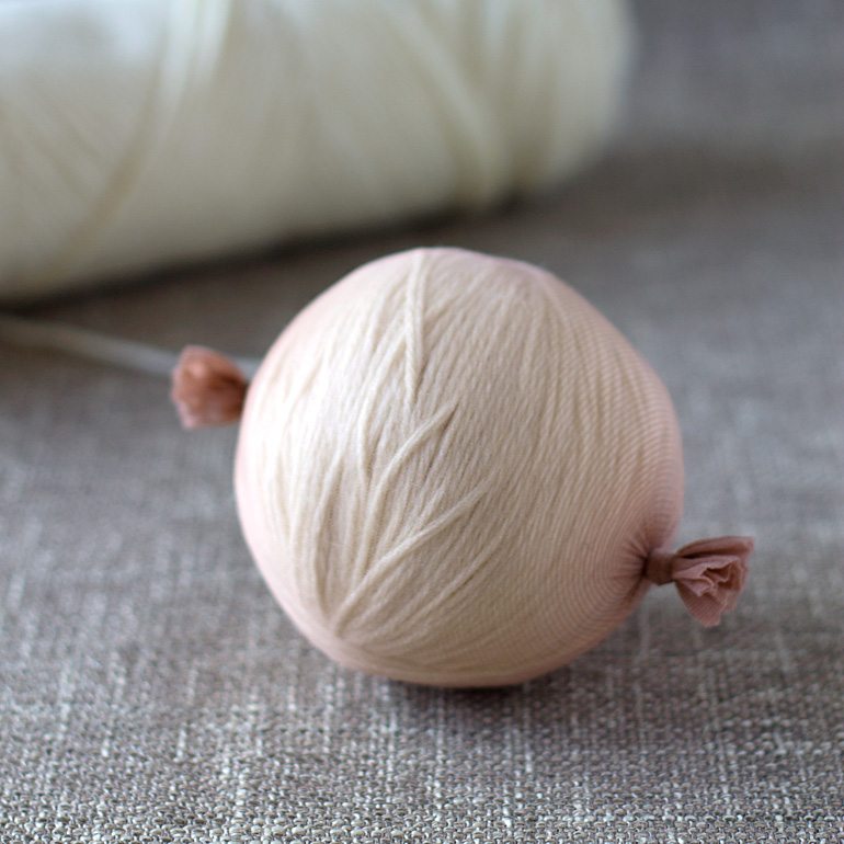 Discover money saving natural laundry tips and tricks and learn how to make wool dryer balls to soften clothes and speed drying time, naturally.