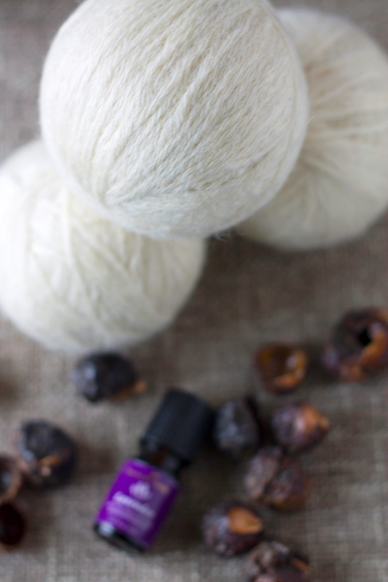 Discover money saving natural laundry tips and tricks and learn how to make wool dryer balls to soften clothes and speed drying time, naturally.