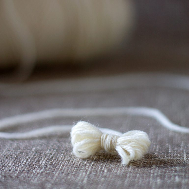 Discover money saving natural laundry tips and tricks and learn how to make wool dryer balls to soften clothes and speed drying time, naturally. 