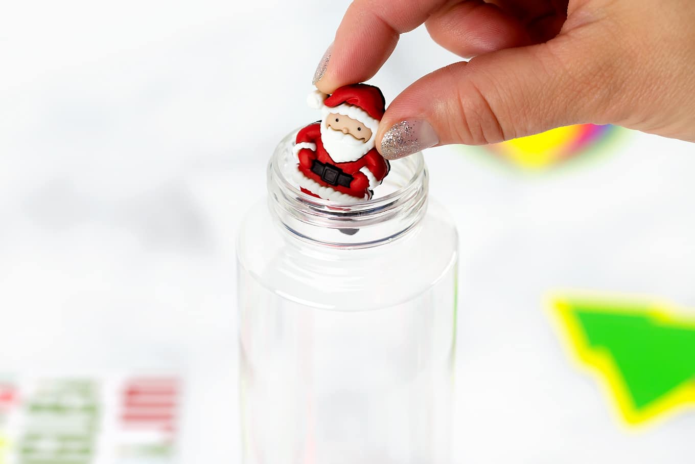 Santa Button Going Into Sensory Bottle