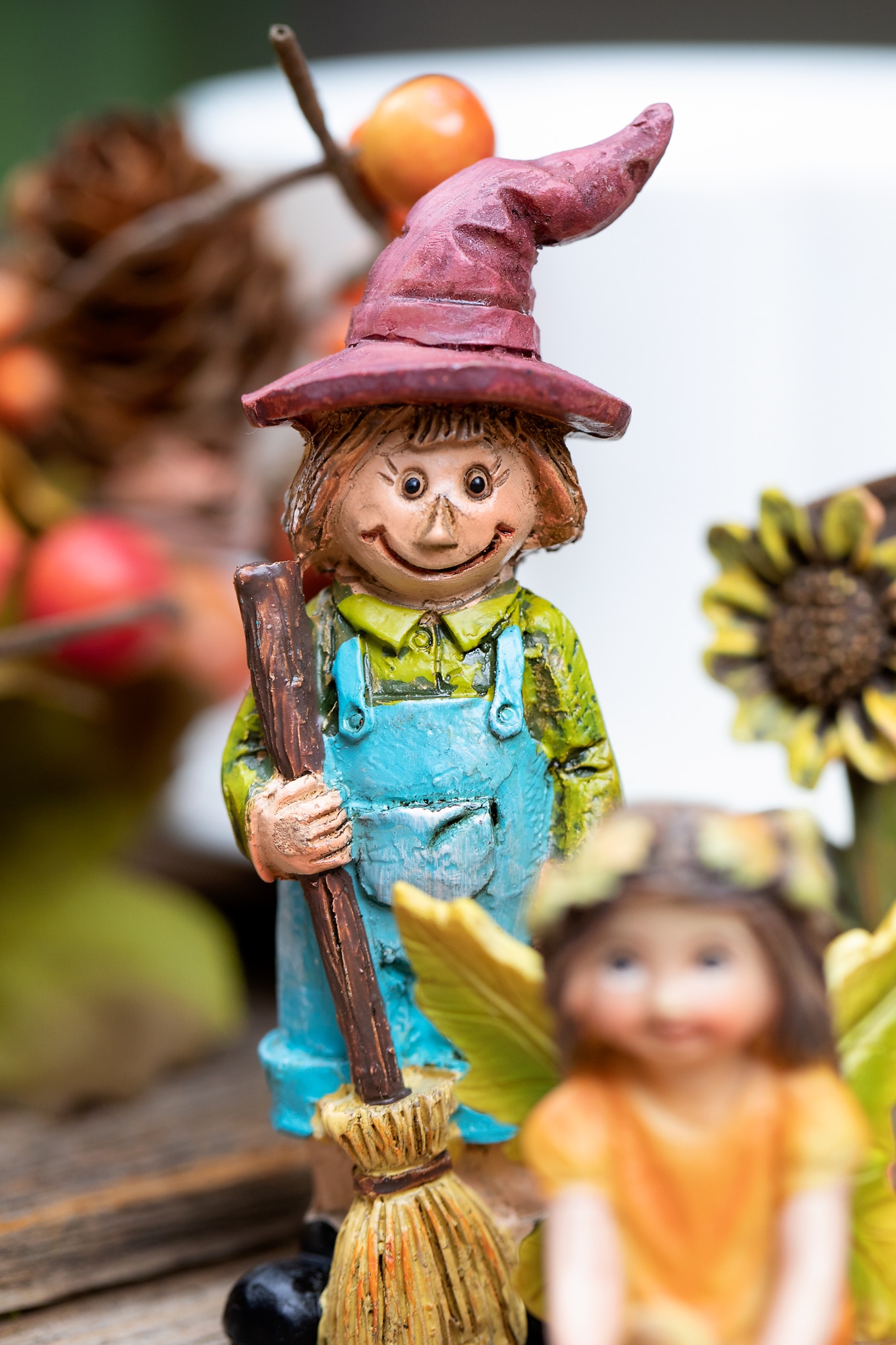 Resin Scarecrow in Fall Teacup Garden