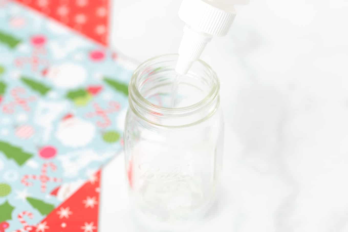 Pouring Floor Polish Into Mason Jar