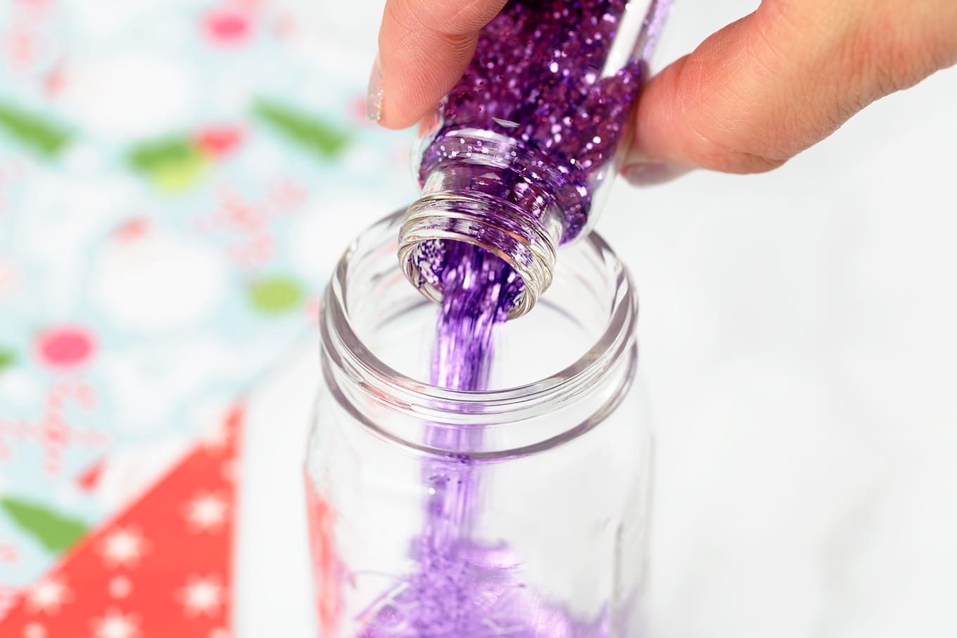 Purple Glitter Pouring Into Mason Jar