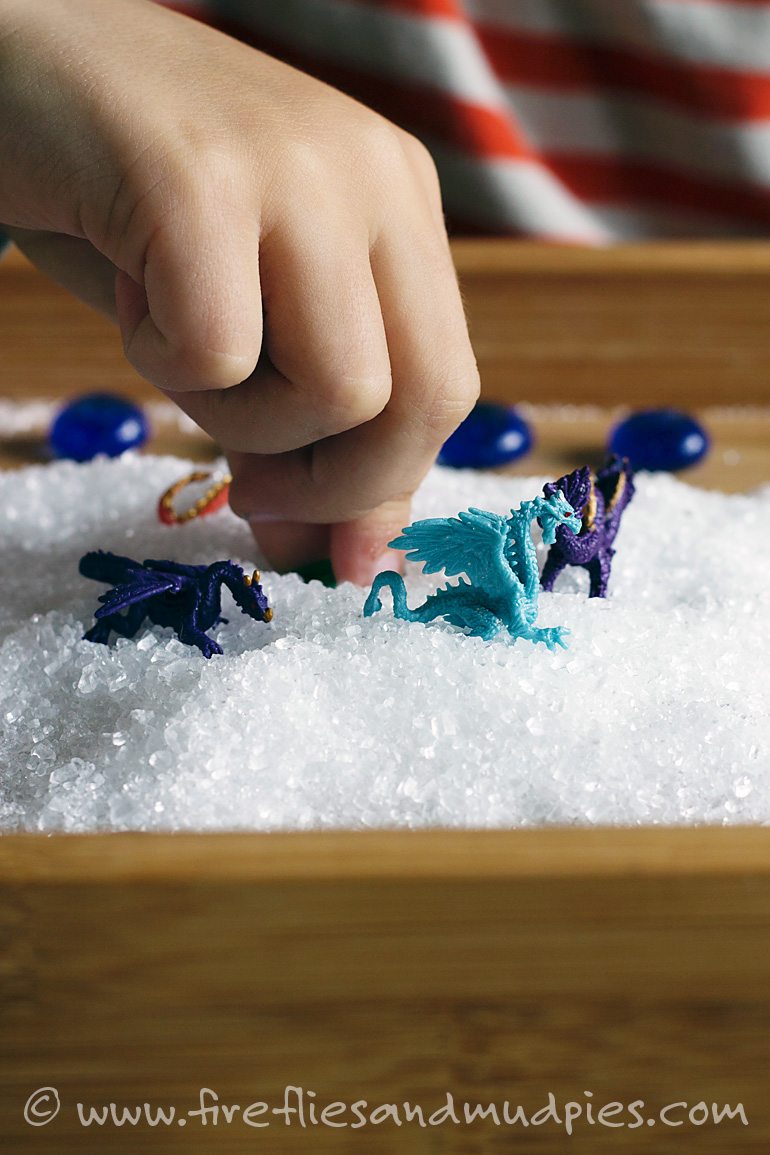 Playing with dragons in a salt sensory bin | Fireflies and Mud Pies