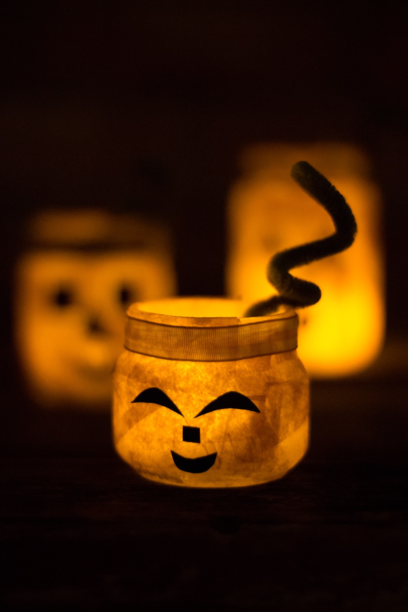 Kids of all ages will love creating a colorful and fun Jack O'Lantern Nightlight Jar for Halloween. This glowing Halloween craft is perfect for school or home. #pumpkincrafts #halloweencrafts #jackolanterncrafts #kidscrafts #nightlightjars #easycraftsforkids #tissuepapercrafts Jack O'Lantern Nightlight Jars