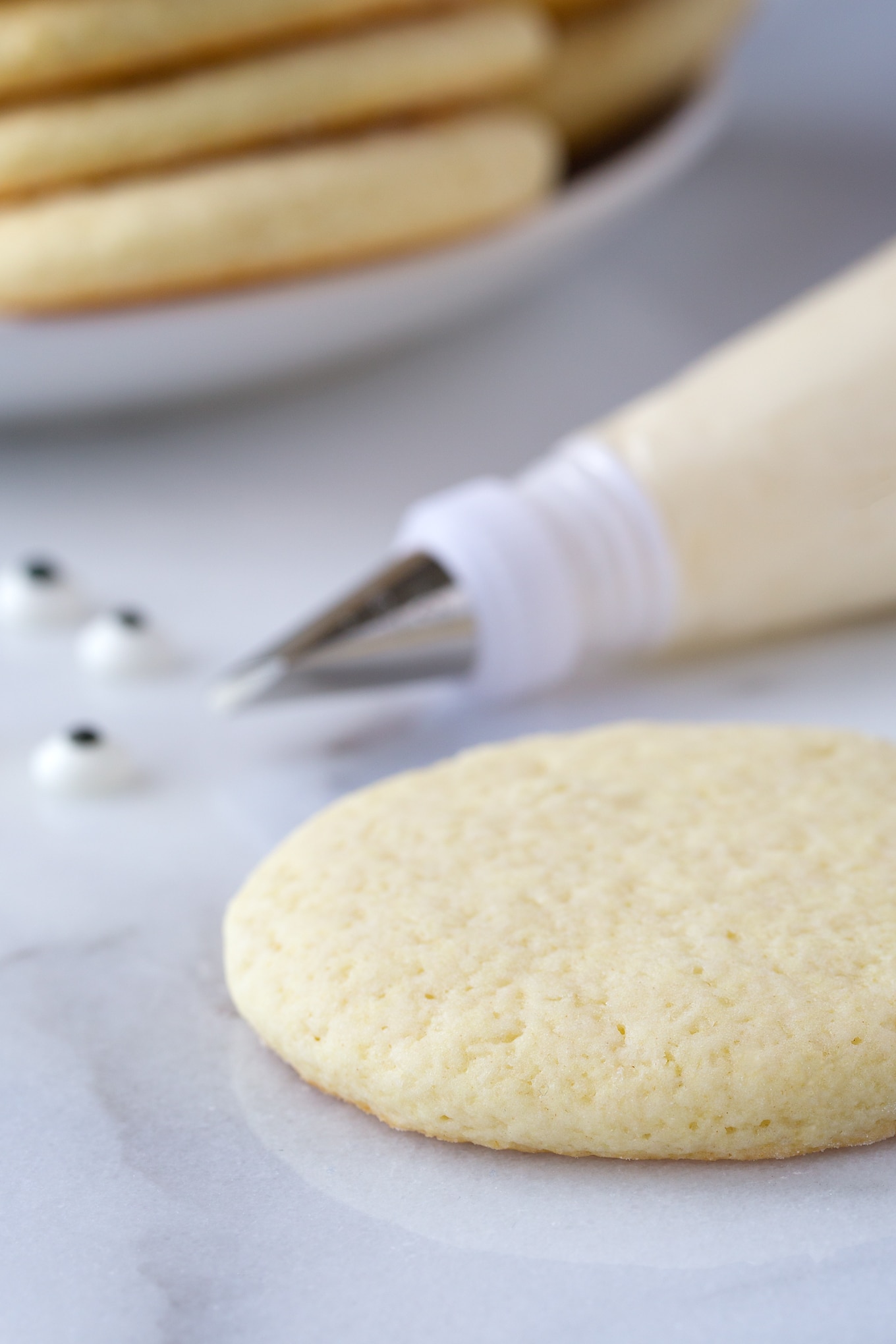 Soft Sour Cream Cookies Being Decorated with Homemade Buttercream Frosting